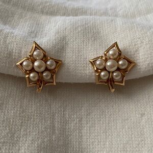 Vintage Trifari gold-tone leaf earrings with faux pearls.